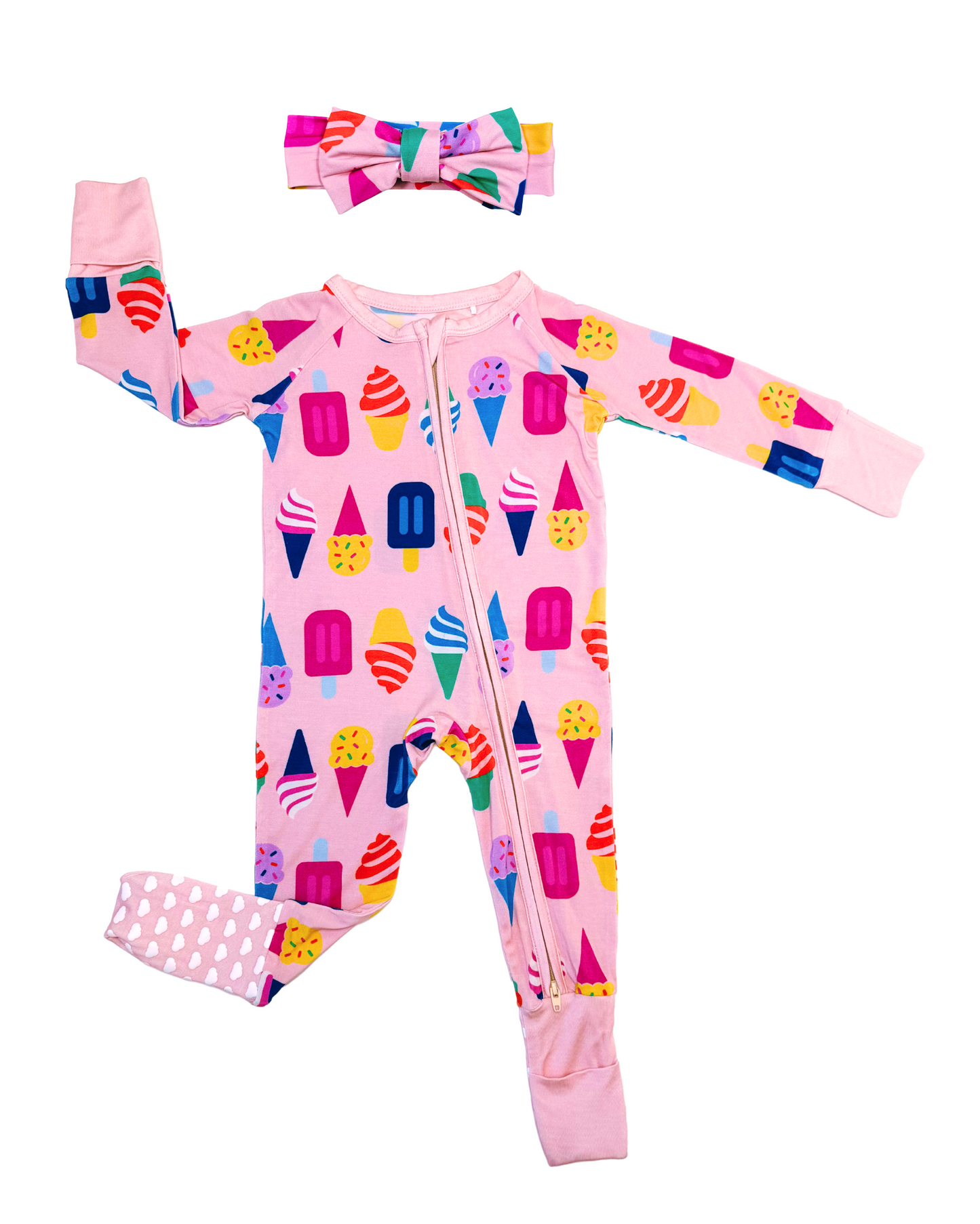Pink infant zip-up onesie with ice cream motifs and matching headband, made from soft cotton.