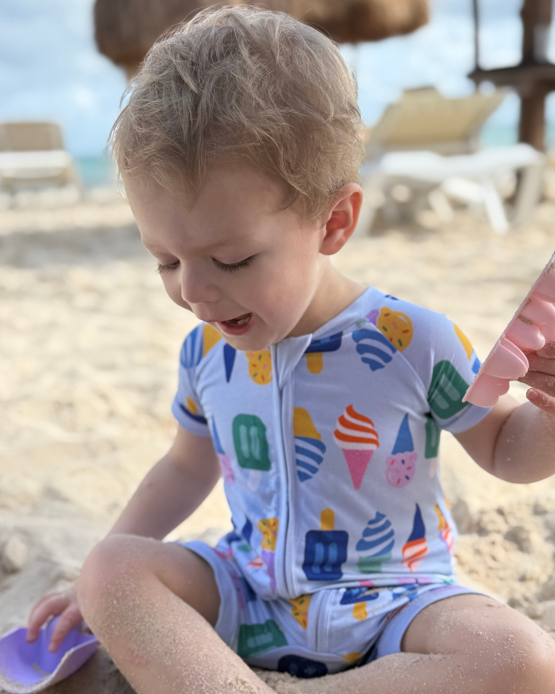 Toddler beachwear in light blue with fun ice cream print, perfect for sunny days.