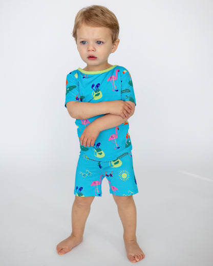 Blue kids' swimsuit set featuring colorful flamingo and sun patterns, made of soft, breathable fabric.