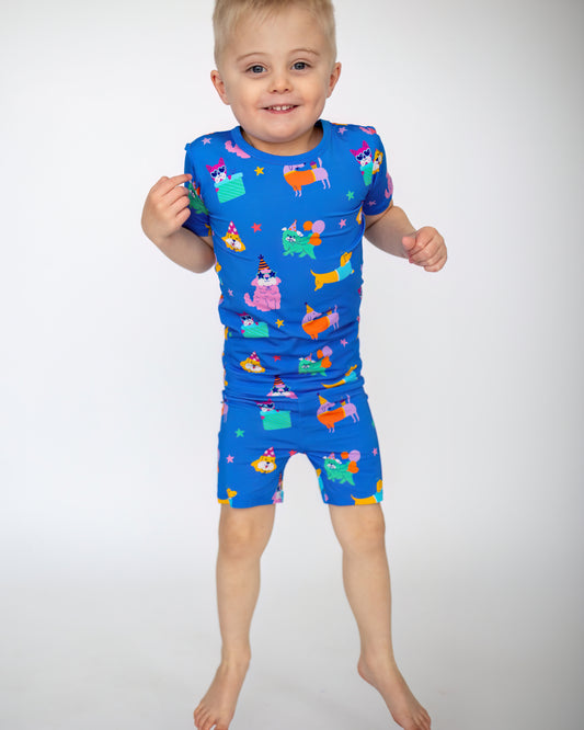 Colorful kids' swimsuit in blue with fun animal prints, perfect for summer playtime.