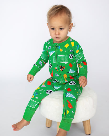 Green children's pajamas featuring fun sports-themed prints, made from soft, breathable material.