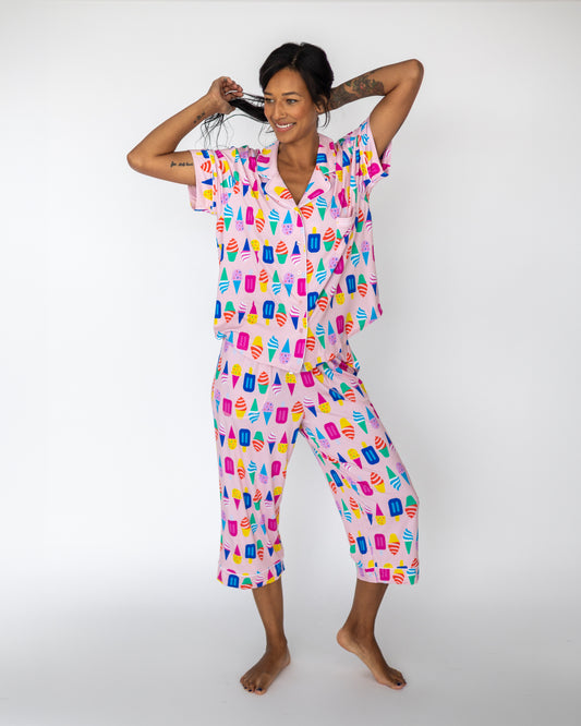 Women's ice cream print pajama set in pink, featuring short sleeves and cropped pants for a fun, cute look.