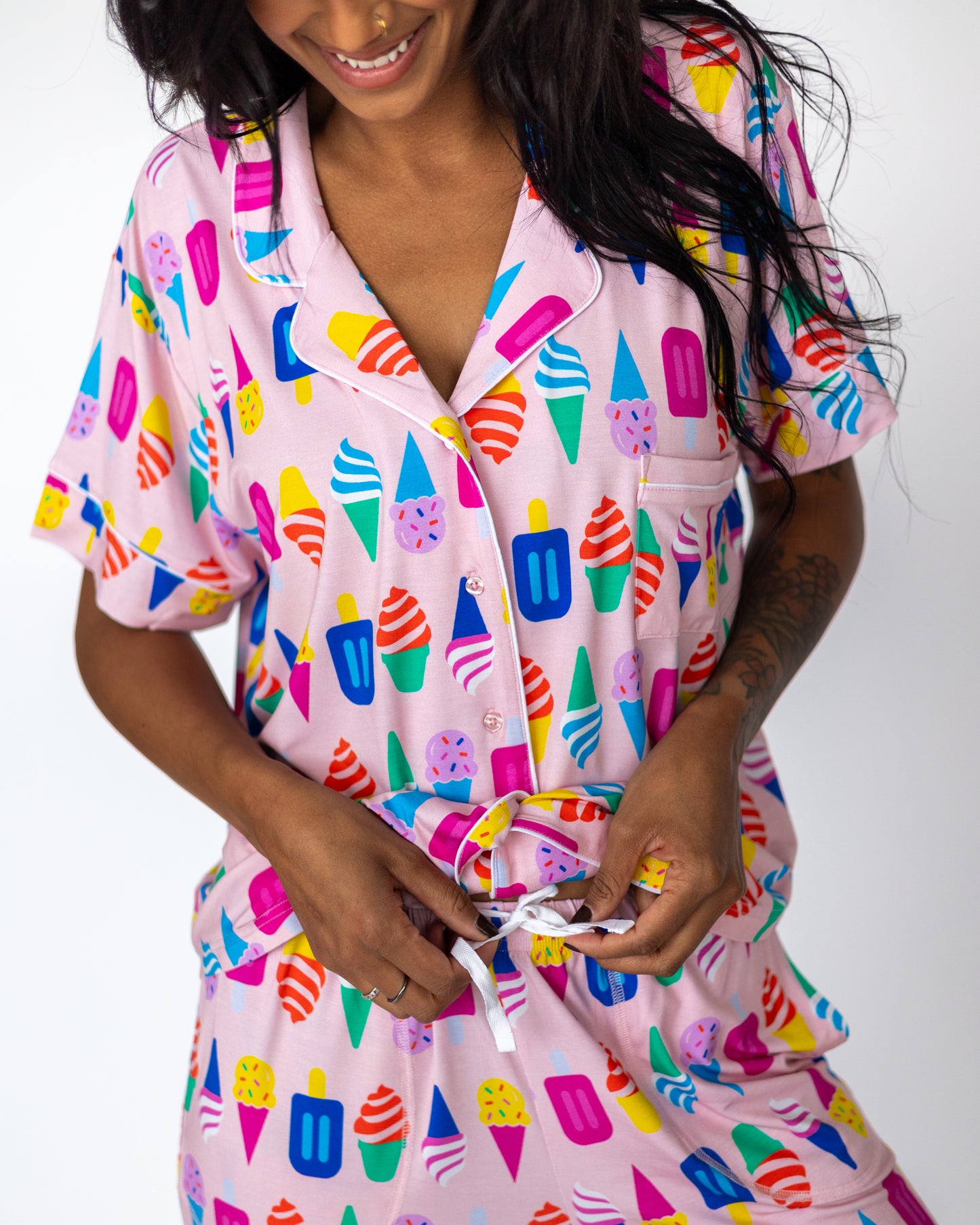 Colorful ice cream print women's pajama set in pink, featuring a button-up shirt and drawstring shorts.
