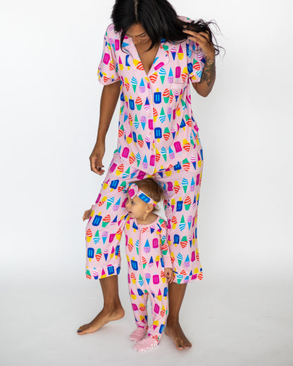 Matching ice cream print pajamas for women and toddlers in soft pink fabric, perfect for cozy nights.