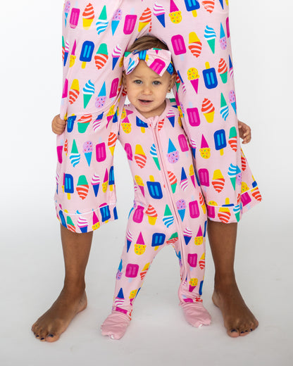 Matching pink ice cream print pajamas for adult and toddler, made from soft cotton material.