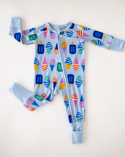 Light blue kids' onesie featuring colorful ice cream print, made of soft cotton fabric, with a front zipper.