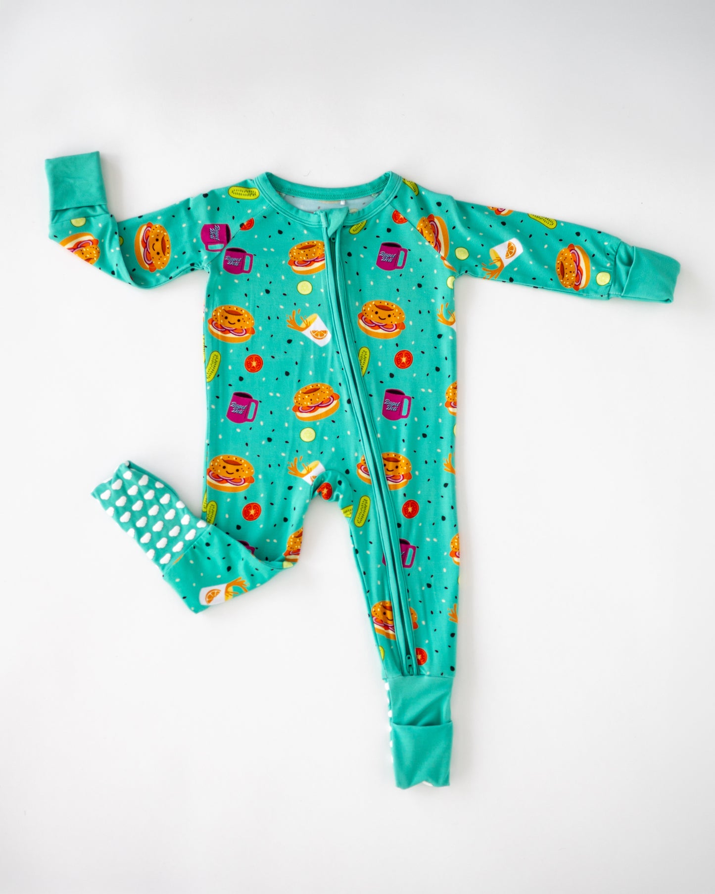 Teal children's pajamas with fun food print, featuring burgers, fries, and drinks, soft fabric, zip front.