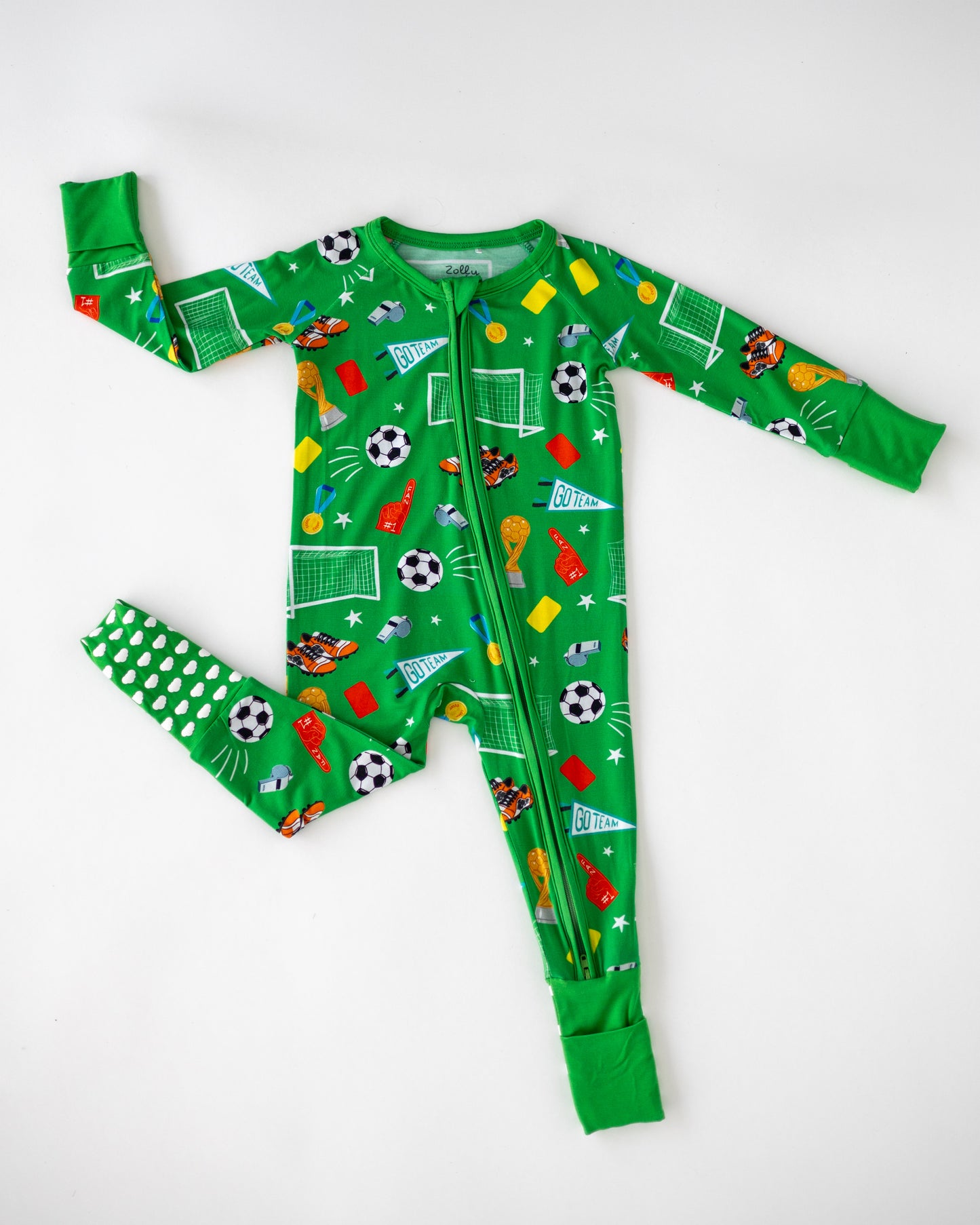 Kids' green soccer-themed onesie, fun print, soft material, featuring sports motifs and a zipper closure.