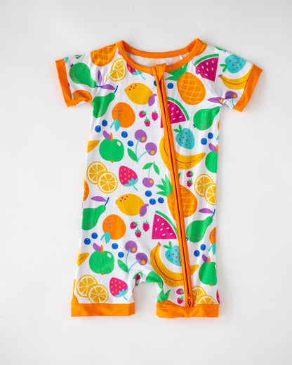 Colorful fruit-patterned kids' romper with short sleeves and orange trim, made of soft, breathable material.