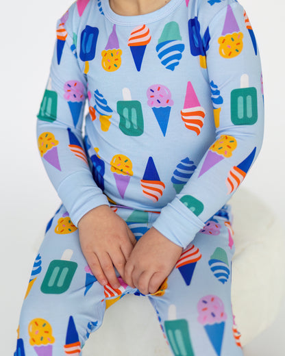 Colorful ice cream-themed kids' pajamas in blue, made from soft, breathable fabric.