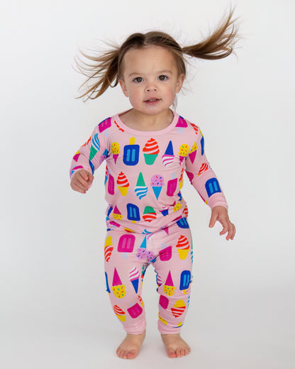 Colorful kids' pajamas set featuring ice cream and popsicle prints, soft pink fabric, full sleeves.