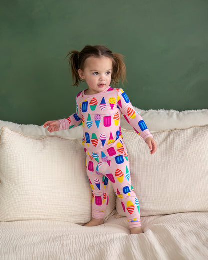 Colorful ice cream print toddler pajamas in pink, soft cotton, featuring long sleeves and pants.