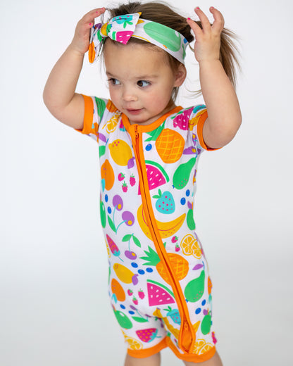 Colorful toddler swim romper with fruit prints, short sleeves, and zipper, perfect for summer fun.